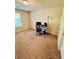 Bedroom with a computer desk and neutral carpeting at 5848 Rex Ridge Loop, Rex, GA 30273