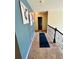 Second story hallway with a dark blue runner at 5848 Rex Ridge Loop, Rex, GA 30273