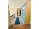 Upstairs hallway featuring a runner and decorative wall art at 5848 Rex Ridge Loop, Rex, GA 30273