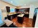 Modern kitchen features granite countertops, stainless steel appliances, and a convenient center island at 5848 Rex Ridge Loop, Rex, GA 30273