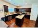 Well-lit kitchen boasts granite countertops, stainless steel appliances, and a functional center island at 5848 Rex Ridge Loop, Rex, GA 30273