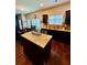 Modern kitchen with granite countertops, stainless steel appliances, and hardwood floors at 5848 Rex Ridge Loop, Rex, GA 30273