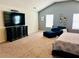 Large primary bedroom offering a navy blue ottoman and decorative wall art at 5848 Rex Ridge Loop, Rex, GA 30273