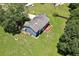 An aerial view of a two-story home with a deck overlooking a spacious green lawn at 2505 Se Tiffany Ct, Conyers, GA 30013
