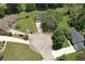 Aerial view of a home nestled within a cul-de-sac, surrounded by mature trees and green lawns at 2505 Se Tiffany Ct, Conyers, GA 30013