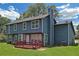 The backyard features a deck and ample green space, providing a perfect area for relaxation and entertainment at 2505 Se Tiffany Ct, Conyers, GA 30013