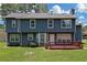 The backyard features a deck and ample green space, providing a perfect area for relaxation and entertainment at 2505 Se Tiffany Ct, Conyers, GA 30013
