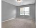 Cozy bedroom with neutral carpet, neutral paint and great natural light at 2505 Se Tiffany Ct, Conyers, GA 30013