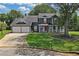 Charming two-story home with a well-manicured lawn, a two-car garage, and a welcoming front porch at 2505 Se Tiffany Ct, Conyers, GA 30013