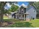 Beautiful two-story home featuring a covered porch, a two-car garage, and a lush green lawn at 2505 Se Tiffany Ct, Conyers, GA 30013