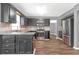 Modern kitchen with stainless steel appliances, granite countertops, and dark cabinets at 2505 Se Tiffany Ct, Conyers, GA 30013