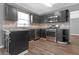 Well-equipped kitchen with stainless steel appliances, granite countertops, and dark cabinetry at 2505 Se Tiffany Ct, Conyers, GA 30013