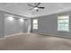Large main bedroom boasts recessed lights, tray ceiling, ceiling fan, and neutral paint at 2505 Se Tiffany Ct, Conyers, GA 30013