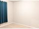 Cozy bedroom with neutral carpet and walls and a stylish blue curtain at 2508 Norwood Park Xing, Atlanta, GA 30340