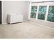 Bedroom showcasing bright windows, light carpet and ample space, plus a white dresser at 2508 Norwood Park Xing, Atlanta, GA 30340