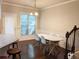 Eat in dining area with a white oval table, seating for 4 and views of the backyard at 2508 Norwood Park Xing, Atlanta, GA 30340