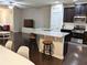 Open kitchen featuring granite countertops, stainless steel appliances, and a breakfast bar overlooking the living area at 2508 Norwood Park Xing, Atlanta, GA 30340