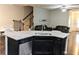Open kitchen featuring granite countertops, stainless steel appliances, and a breakfast bar overlooking the living area at 2508 Norwood Park Xing, Atlanta, GA 30340