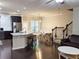 Open living space featuring a spacious kitchen island, dining area, and staircase at 2508 Norwood Park Xing, Atlanta, GA 30340