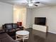 Cozy living room featuring hardwood floors and a modern TV console for media at 2508 Norwood Park Xing, Atlanta, GA 30340