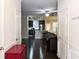 Open-concept living space with hardwood floors, seamlessly connecting the kitchen, dining, and living areas at 2508 Norwood Park Xing, Atlanta, GA 30340