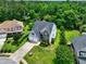 Beautiful aerial view of the home with a two car garage and spacious green lawn at 347 Cobblestone Court, Hampton, GA 30228