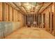 Unfinished basement featuring exposed beams, concrete floor and unfinished walls at 347 Cobblestone Court, Hampton, GA 30228