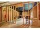 Unfinished basement featuring exposed beams, concrete floor and blacked out ceiling at 347 Cobblestone Court, Hampton, GA 30228