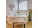 Relaxing corner bathtub with natural light and stylish tile surround at 347 Cobblestone Court, Hampton, GA 30228