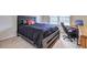 Comfortable bedroom featuring natural light and a desk area at 347 Cobblestone Court, Hampton, GA 30228