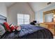 Bedroom with vaulted ceiling featuring natural light and a desk area at 347 Cobblestone Court, Hampton, GA 30228
