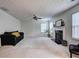 Cozy living room with a decorative fireplace, large windows, and comfortable seating arrangement at 347 Cobblestone Court, Hampton, GA 30228