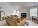 Bright living room with plush seating, a vaulted ceiling, and large windows at 347 Cobblestone Court, Hampton, GA 30228