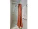 Efficient shower featuring a shower curtain, built-in shelves, and a towel rack at 347 Cobblestone Court, Hampton, GA 30228