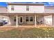 Backyard view showcasing the patio and home exterior at 911 Sonoma Dr, Lawrenceville, GA 30045