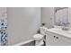Neutral bathroom with a single vanity, toilet, and shower-tub combination, creating a serene space at 911 Sonoma Dr, Lawrenceville, GA 30045