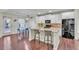 Eat-in kitchen featuring granite countertops, island with seating, white cabinets, and stainless appliances at 911 Sonoma Dr, Lawrenceville, GA 30045