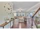 Bright living room with hardwood floors, neutral decor, and a large sectional sofa with lots of natural light at 911 Sonoma Dr, Lawrenceville, GA 30045
