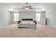 Spacious main bedroom with tray ceiling, ceiling fan, and large windows at 911 Sonoma Dr, Lawrenceville, GA 30045