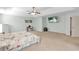 Spacious main bedroom with tray ceiling, ceiling fan, and large windows at 911 Sonoma Dr, Lawrenceville, GA 30045