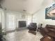 Cozy living room with a granite fireplace and stylish decor creating a comfortable space at 3484 Lynley Mill Ln, Dacula, GA 30019