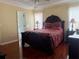 Serene main bedroom featuring hardwood floors, neutral walls, and soft natural light at 3484 Lynley Mill Ln, Dacula, GA 30019