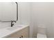 A half bathroom features a modern vanity, quartz countertop, sleek fixtures, and tile flooring at 367 Parkway Ne Dr # 3, Atlanta, GA 30312