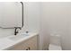 Modern half bathroom features a sleek vanity with a white countertop, and black faucet and hardware at 367 Parkway Ne Dr # 3, Atlanta, GA 30312