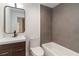 Modern bathroom featuring a sleek vanity, toilet, and tiled shower-tub combination at 367 Parkway Ne Dr # 3, Atlanta, GA 30312