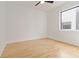 A neutral bedroom features hardwood floors, a ceiling fan, a window, and white trim at 367 Parkway Ne Dr # 3, Atlanta, GA 30312