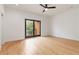 A spacious bedroom features an open balcony, a ceiling fan, and hardwood floors at 367 Parkway Ne Dr # 3, Atlanta, GA 30312