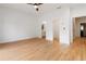 Bright and airy bedroom with hardwood floors, white walls, a ceiling fan, and access to other rooms at 367 Parkway Ne Dr # 3, Atlanta, GA 30312