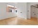 Cozy bedroom featuring hardwood floors, white walls, a modern window, and large closets at 367 Parkway Ne Dr # 3, Atlanta, GA 30312