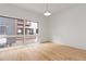 Bright bedroom with hardwood floors and large windows offering views of the neighborhood at 367 Parkway Ne Dr # 3, Atlanta, GA 30312